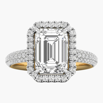 Diamond ring with emerald-cut center stone and halo on a white background