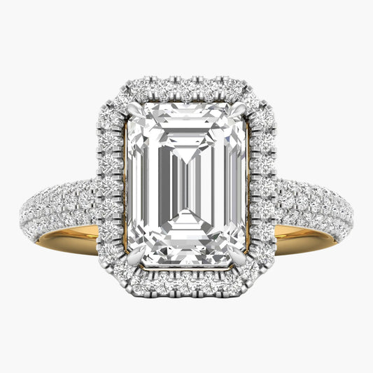 Diamond ring with emerald-cut center stone and halo on a white background