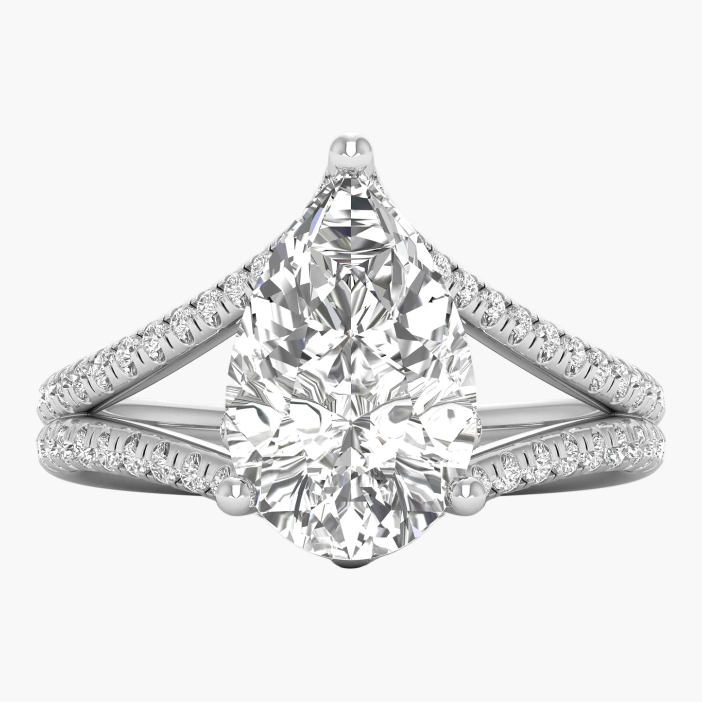 Diamond ring with a pear-shaped center stone on a white background