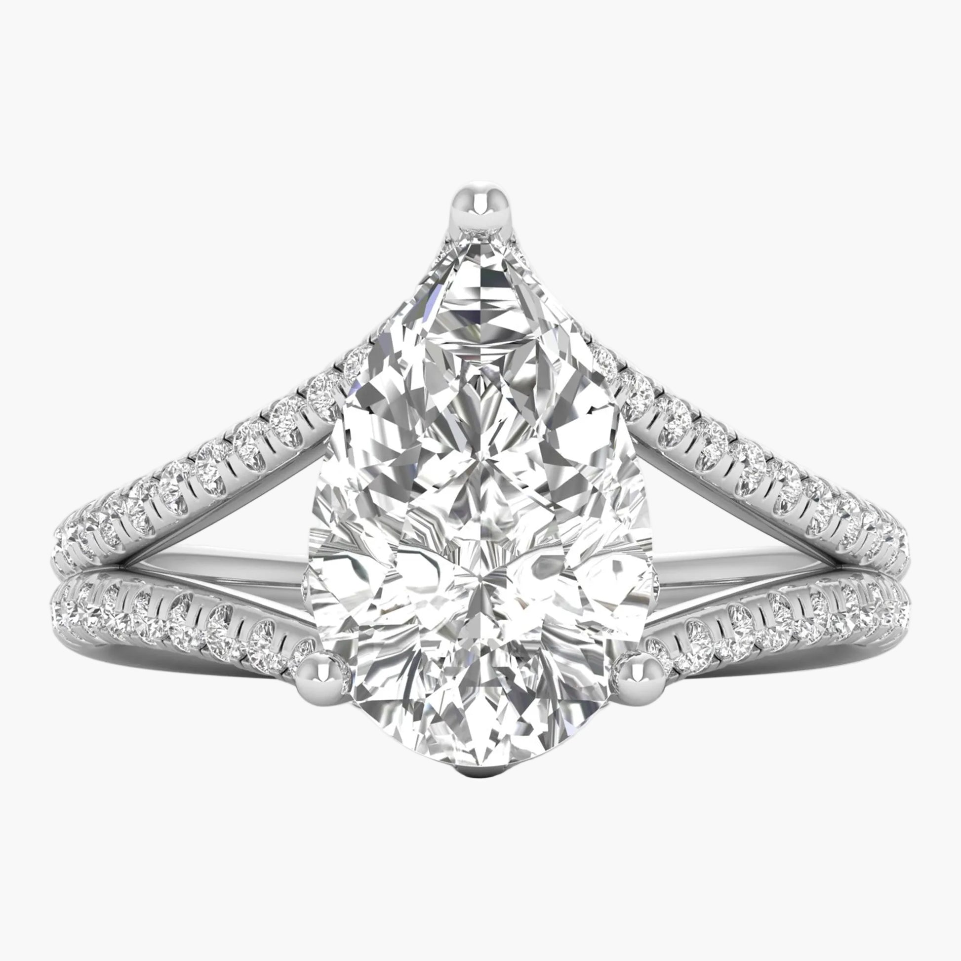 Diamond ring with a pear-shaped center stone on a white background