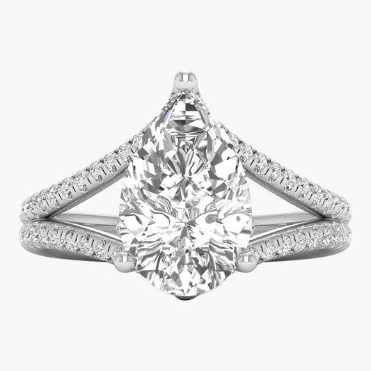 Diamond ring with a pear-shaped center stone on a white background