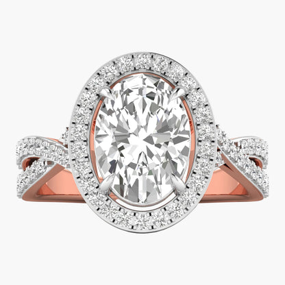 Rose gold and silver ring with a large diamond and smaller diamonds on the band against a white background