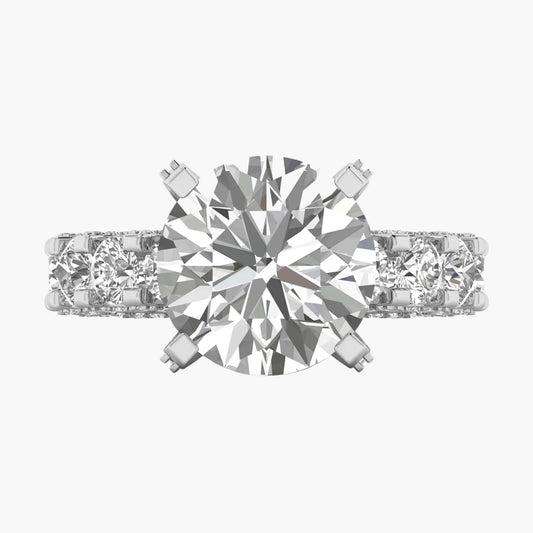 Diamond ring with a central gemstone and two smaller stones on a white background
