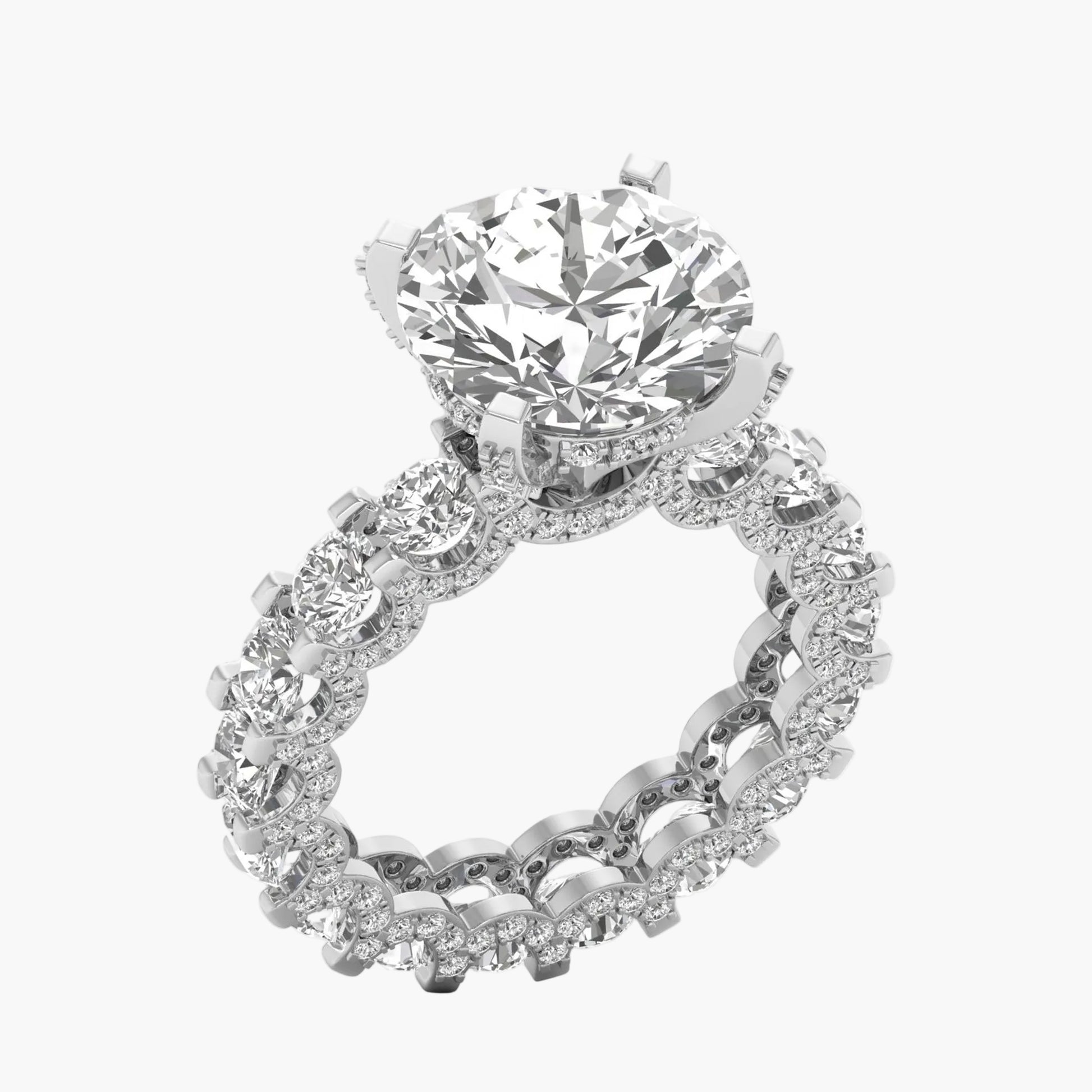Diamond ring with a large central gemstone and smaller stones on a white background