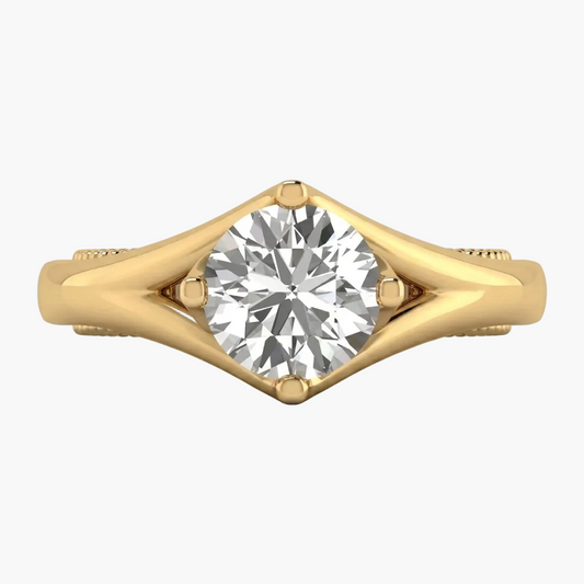 Gold ring with a diamond on a white background