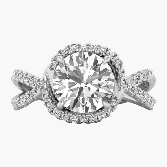 Diamond ring with a large central gemstone and smaller stones on a white background