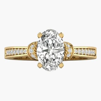 Gold ring with a large diamond and smaller diamonds on the band against a white background