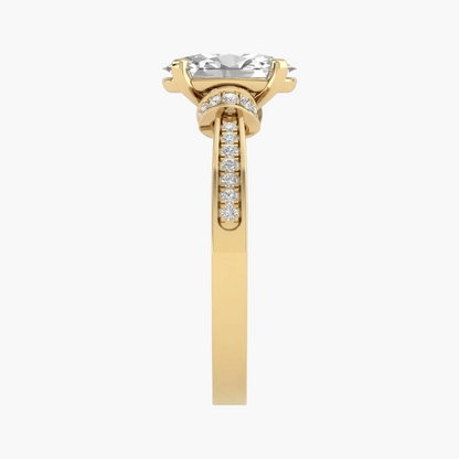 Rose gold ring with a heart-shaped gemstone on a white background