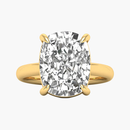 Gold ring with a large diamond on a white background