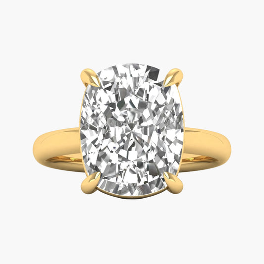 Gold ring with a large diamond on a white background
