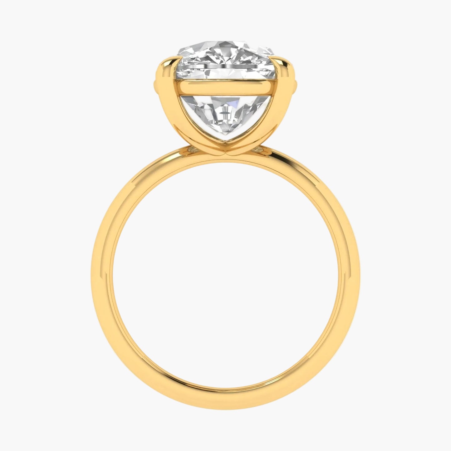 Gold ring with a large diamond on a white background