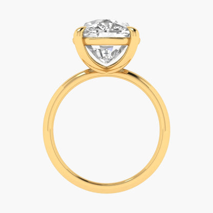 Gold ring with a large diamond on a white background