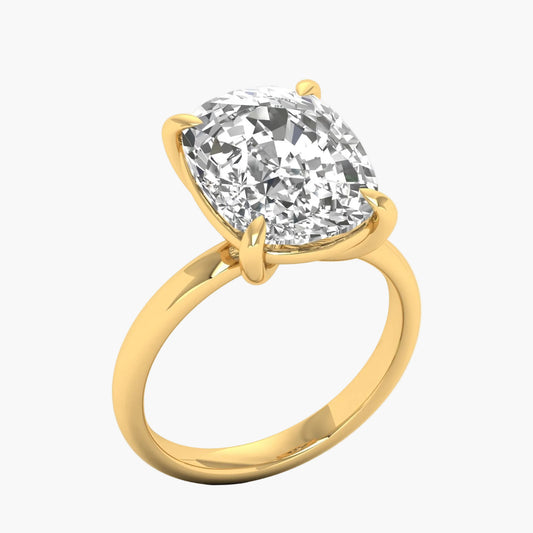 Gold ring with a large diamond on a white background