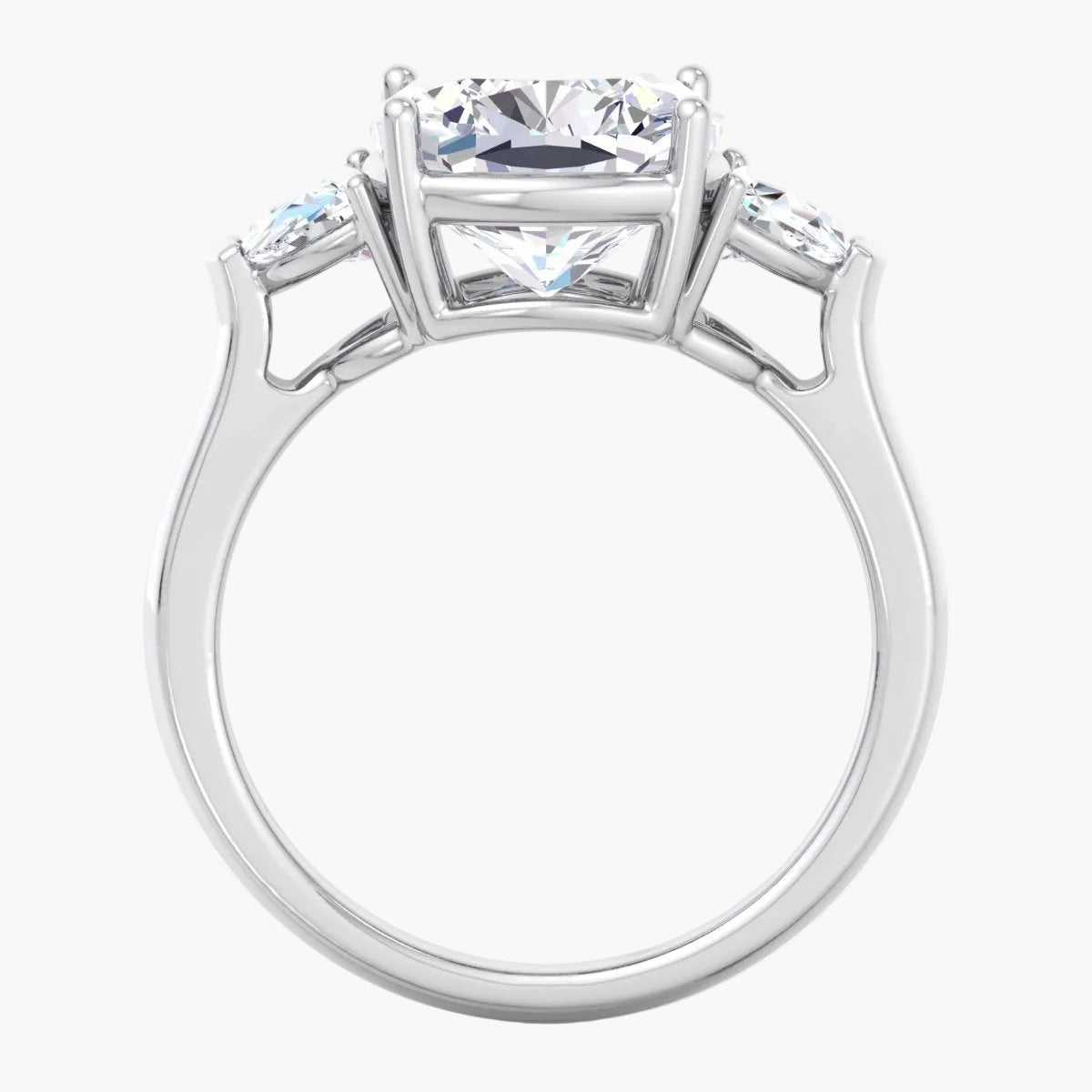 Silver ring with a central diamond and smaller diamonds on the sides against a white background