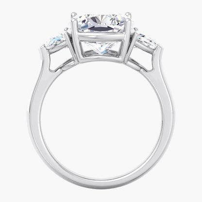 Silver ring with a central diamond and smaller diamonds on the sides against a white background
