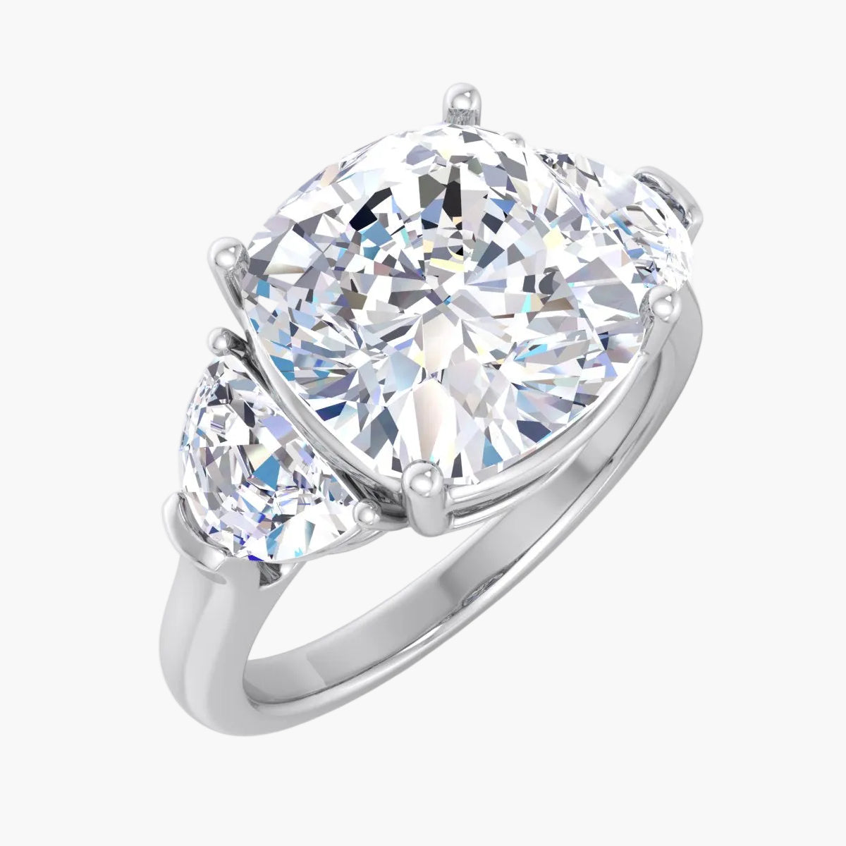 Diamond ring with two smaller diamonds on a white background