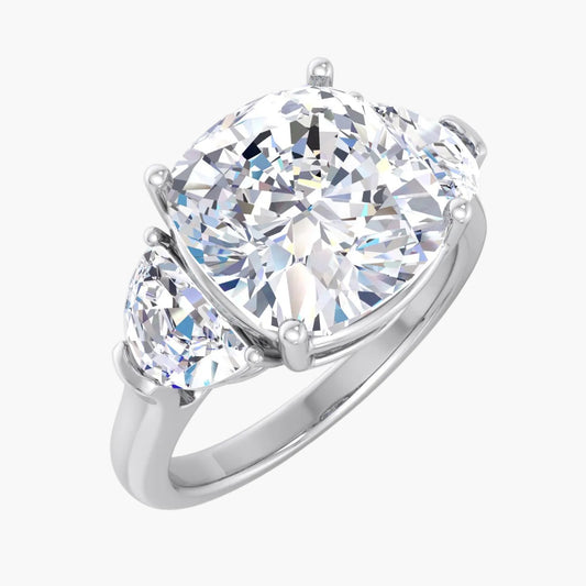 Diamond ring with two smaller diamonds on a white background