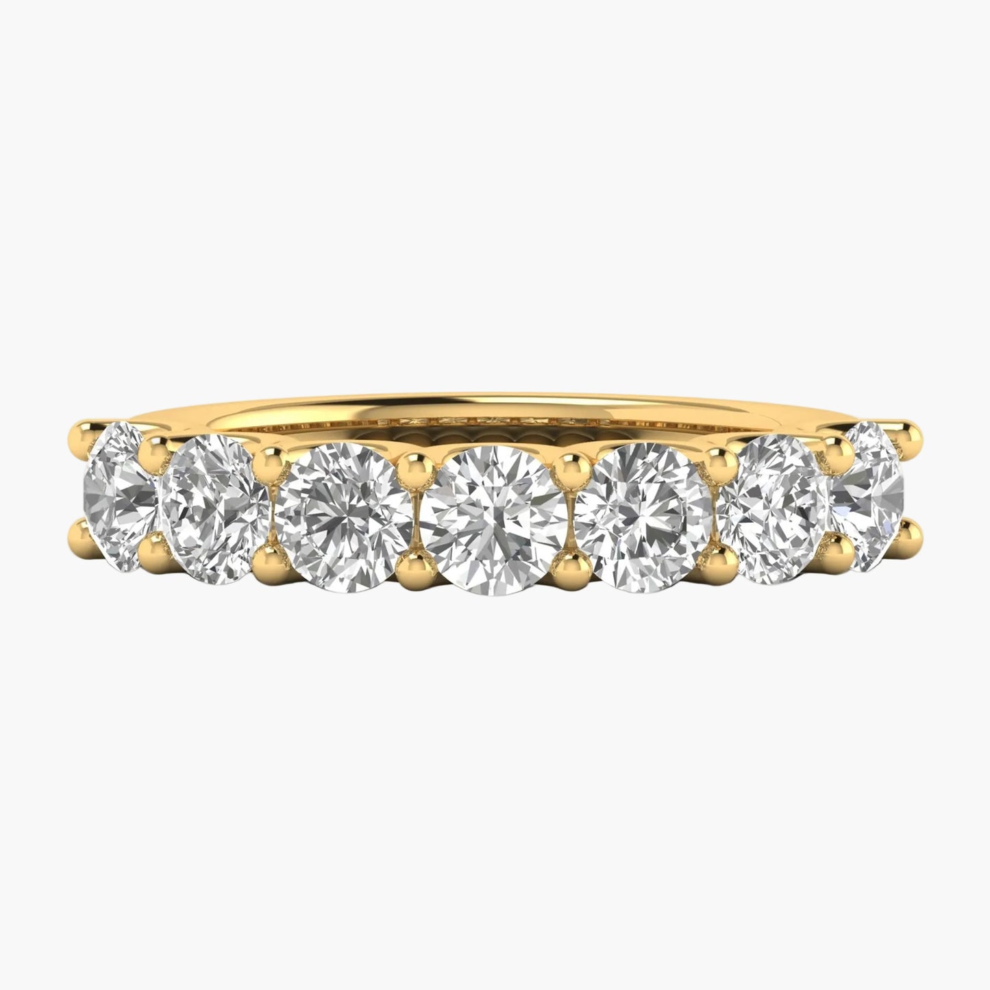 Gold ring with round diamonds on a white background