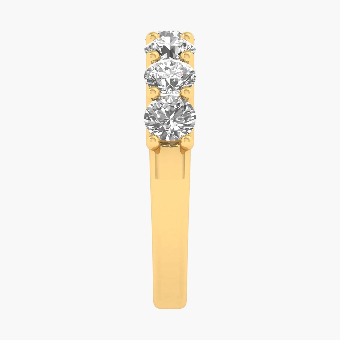 Gold ring with three diamonds on a white background