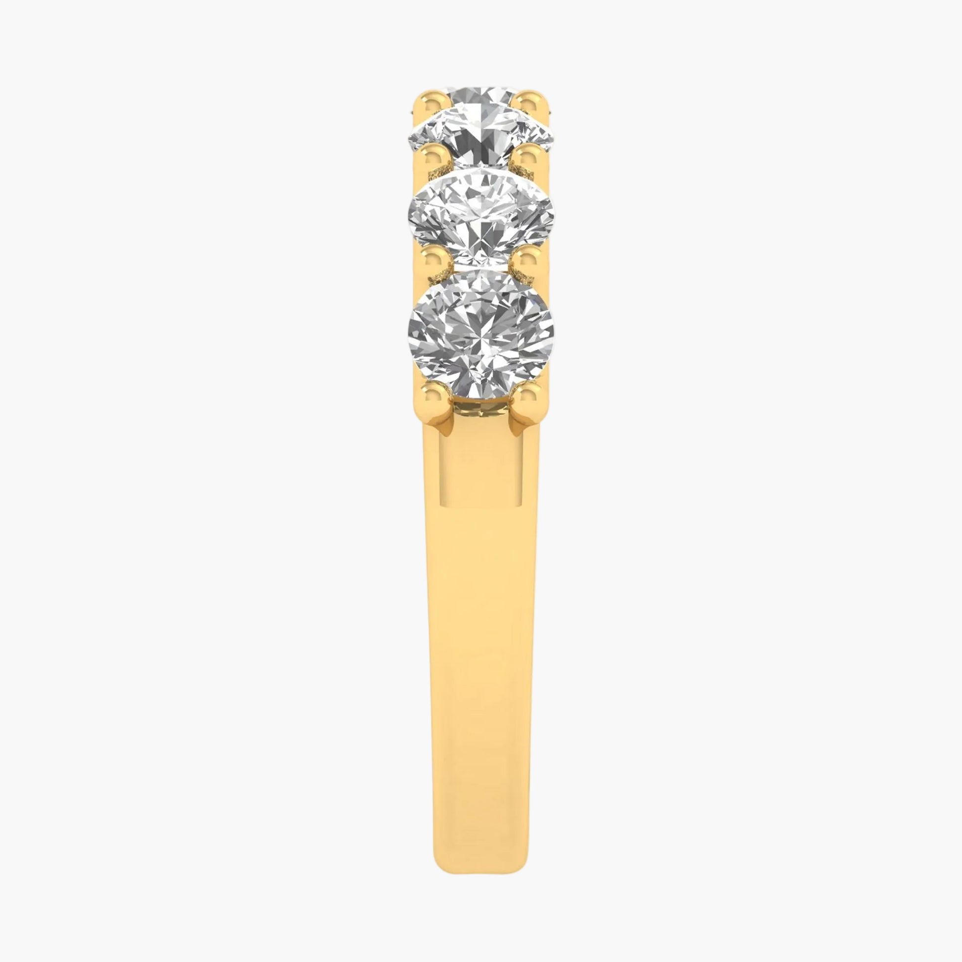 Gold ring with three diamonds on a white background