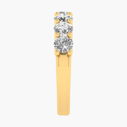 Gold ring with three diamonds on a white background