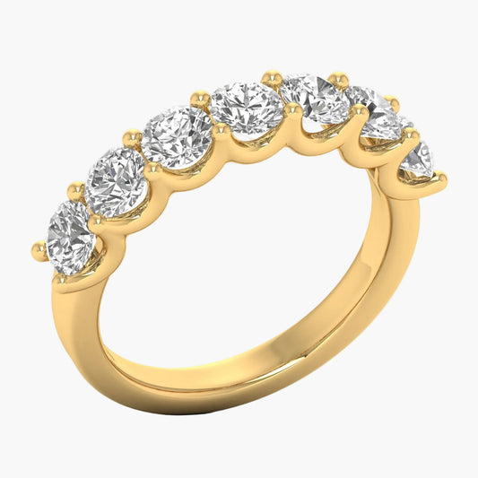 Gold ring with clear gemstones on a white background