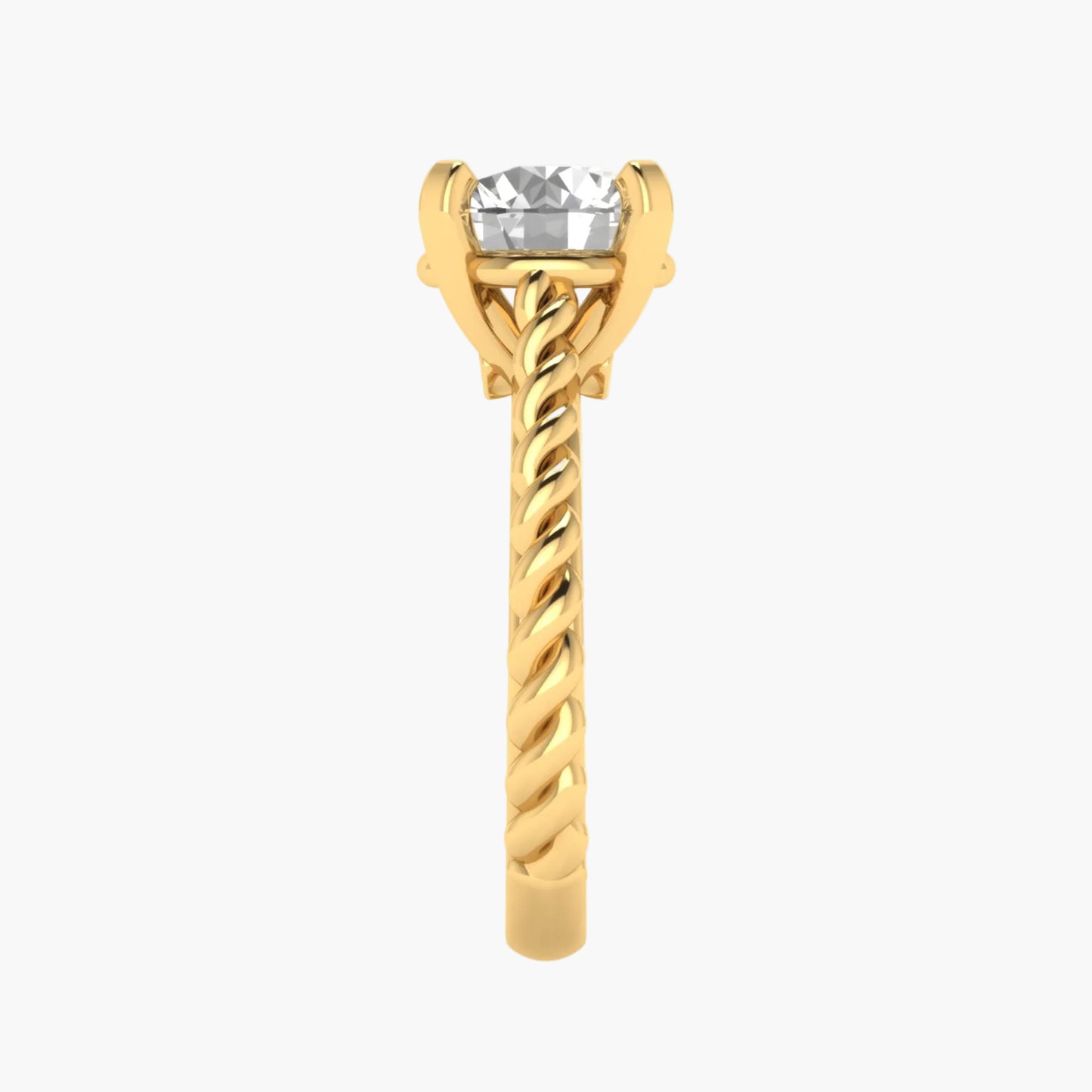 Gold ring with a clear gemstone on a white background