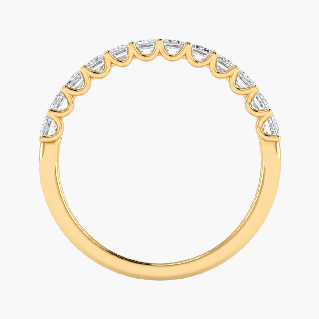 Gold ring with diamond accents on a white background