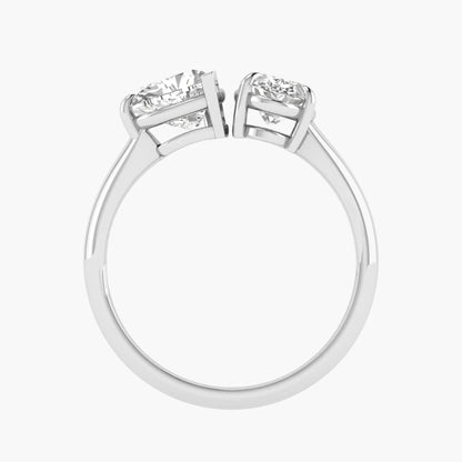 Diamond ring with two smaller diamonds on a white background