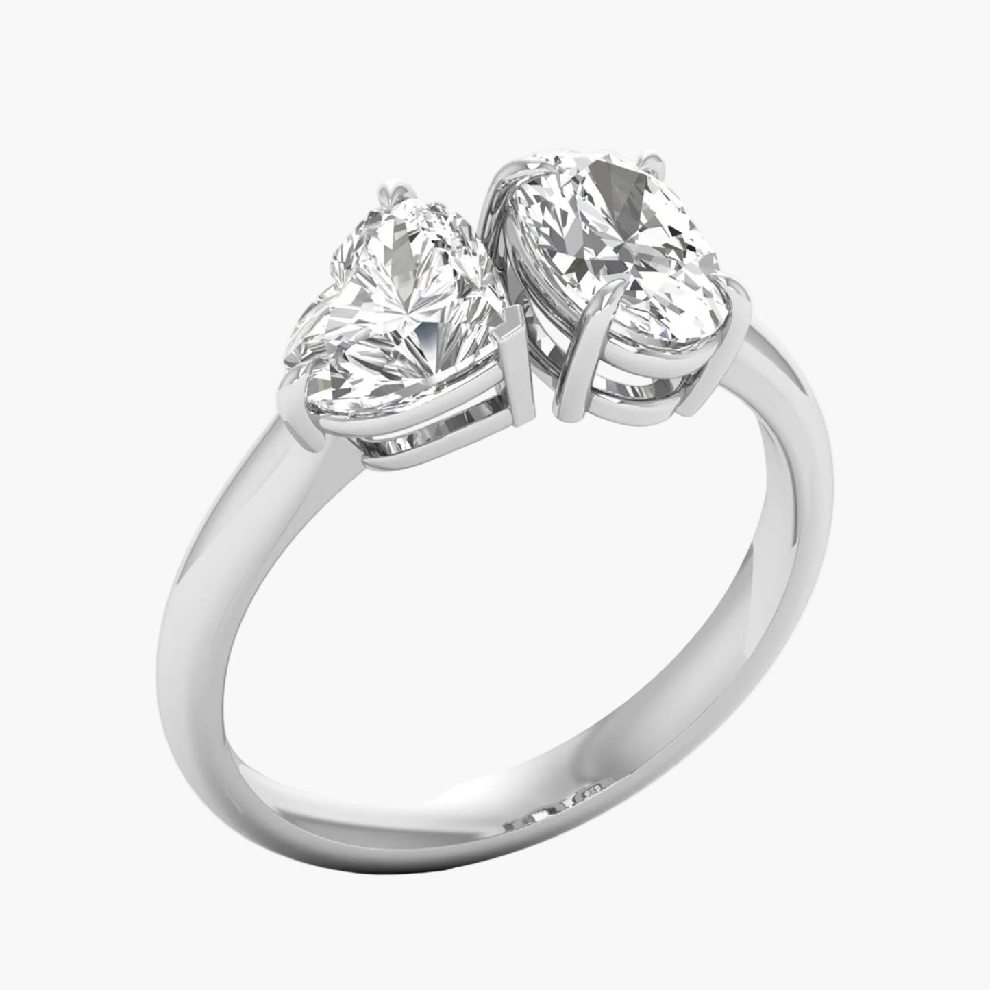 Silver ring with two heart-shaped diamonds on a white background