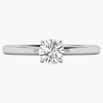 Diamond ring with a white gold band on a white background