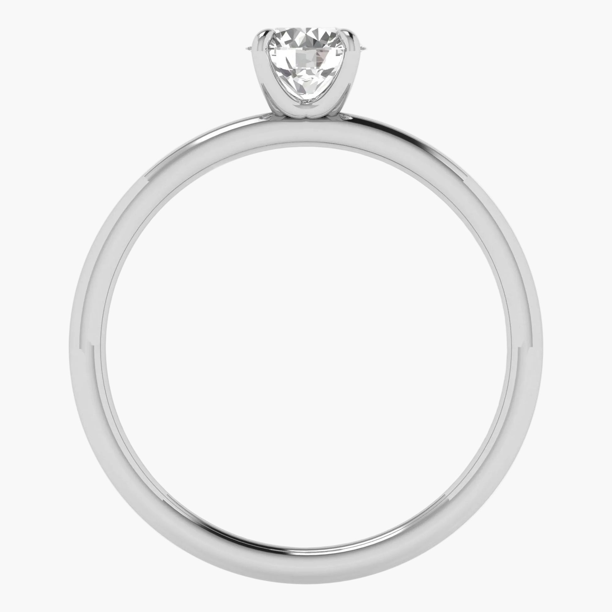 Diamond ring with a heart-shaped center stone on a white background
