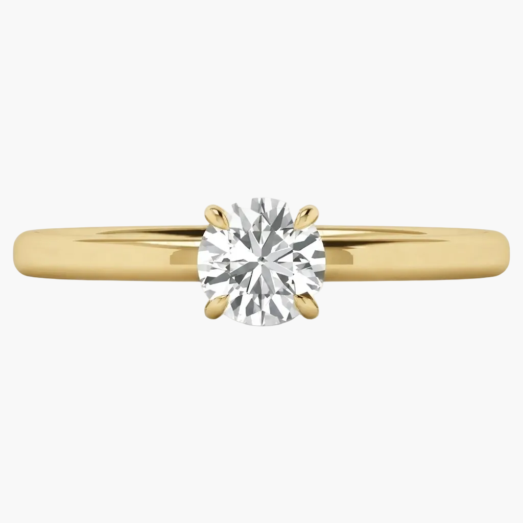 A classic solitaire engagement ring featuring a round brilliant-cut diamond set in a yellow gold four-prong setting on a polished gold band, shown against a clean white background.