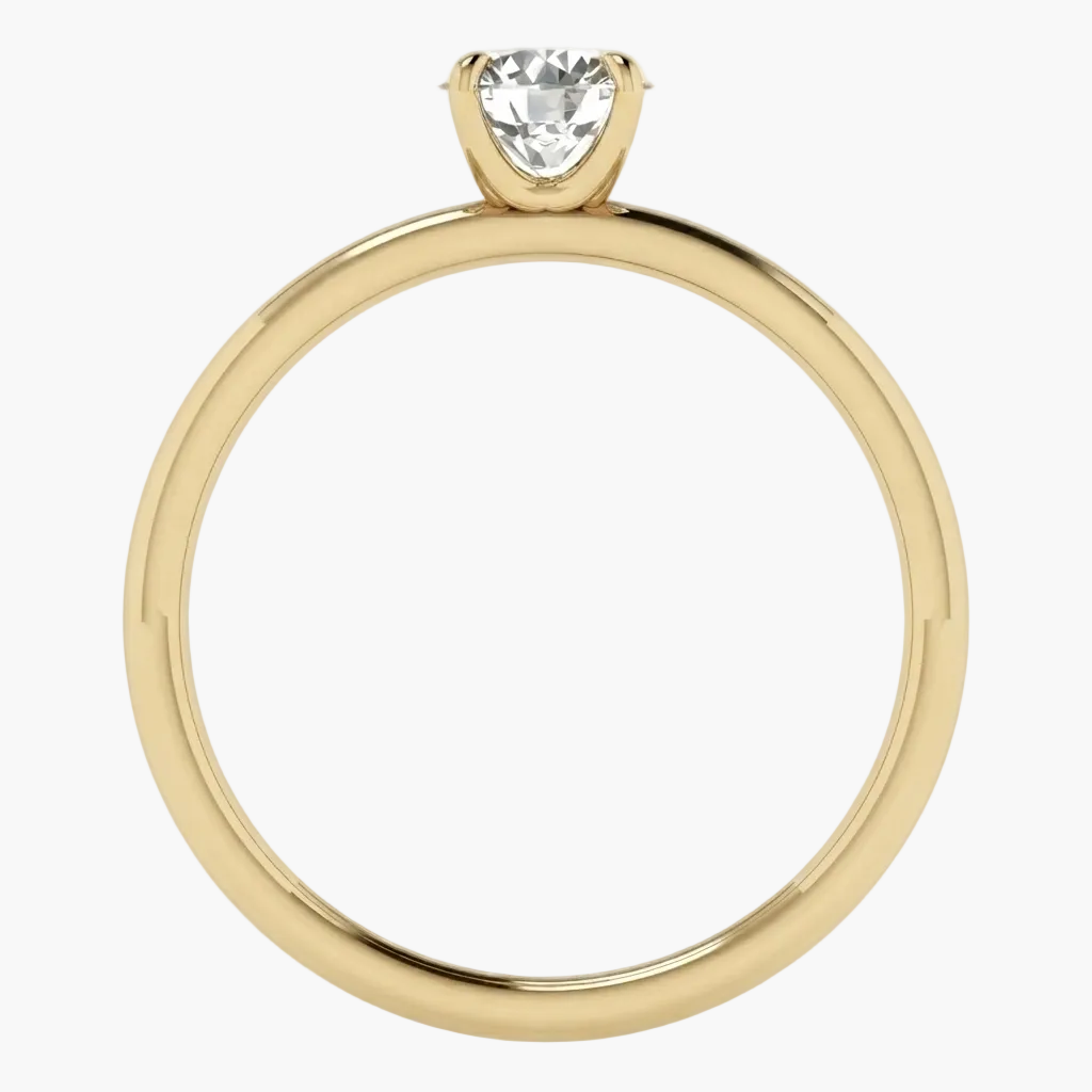 A yellow gold solitaire engagement ring with a pear-cut clear gemstone in a prong setting, shown against a plain white background.
