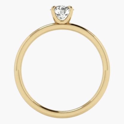 A yellow gold solitaire engagement ring with a pear-cut clear gemstone in a prong setting, shown against a plain white background.