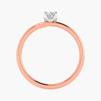 Rose gold ring with a heart-shaped diamond on a white background