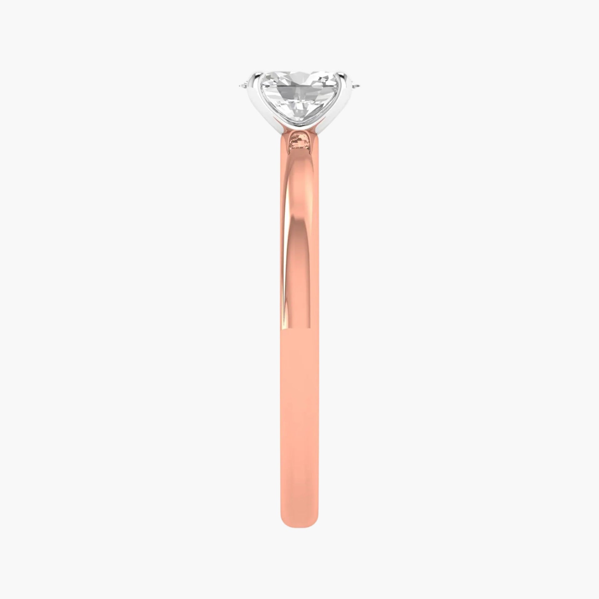 Rose gold ring with a clear gemstone on a white background