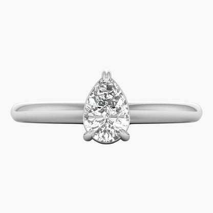 Diamond ring with pear-shaped gemstone on a white background