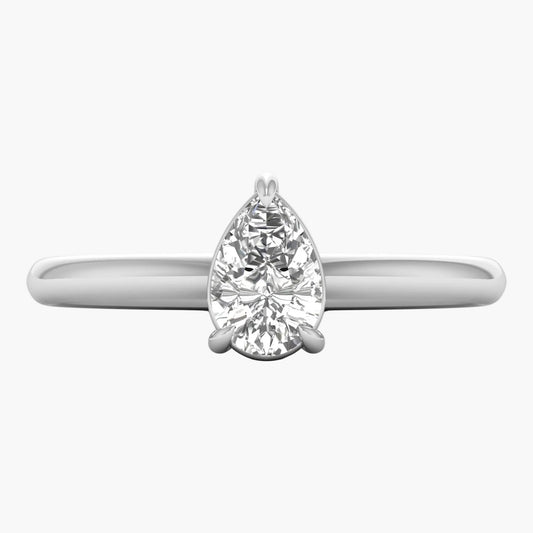 Diamond ring with pear-shaped gemstone on a white background