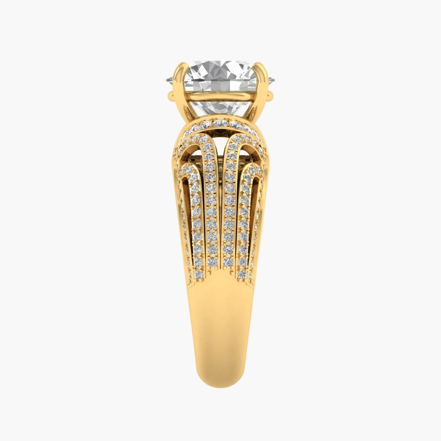 Gold ring with a large diamond and smaller diamonds on the band against a white background