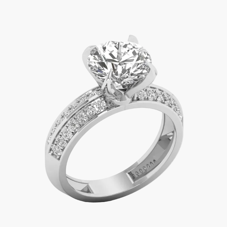 Diamond ring with a large central gemstone and smaller stones on the band against a white background