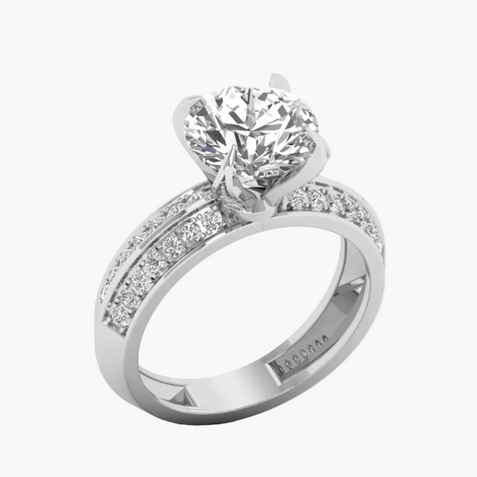 Diamond ring with a large central gemstone and smaller stones on the band against a white background