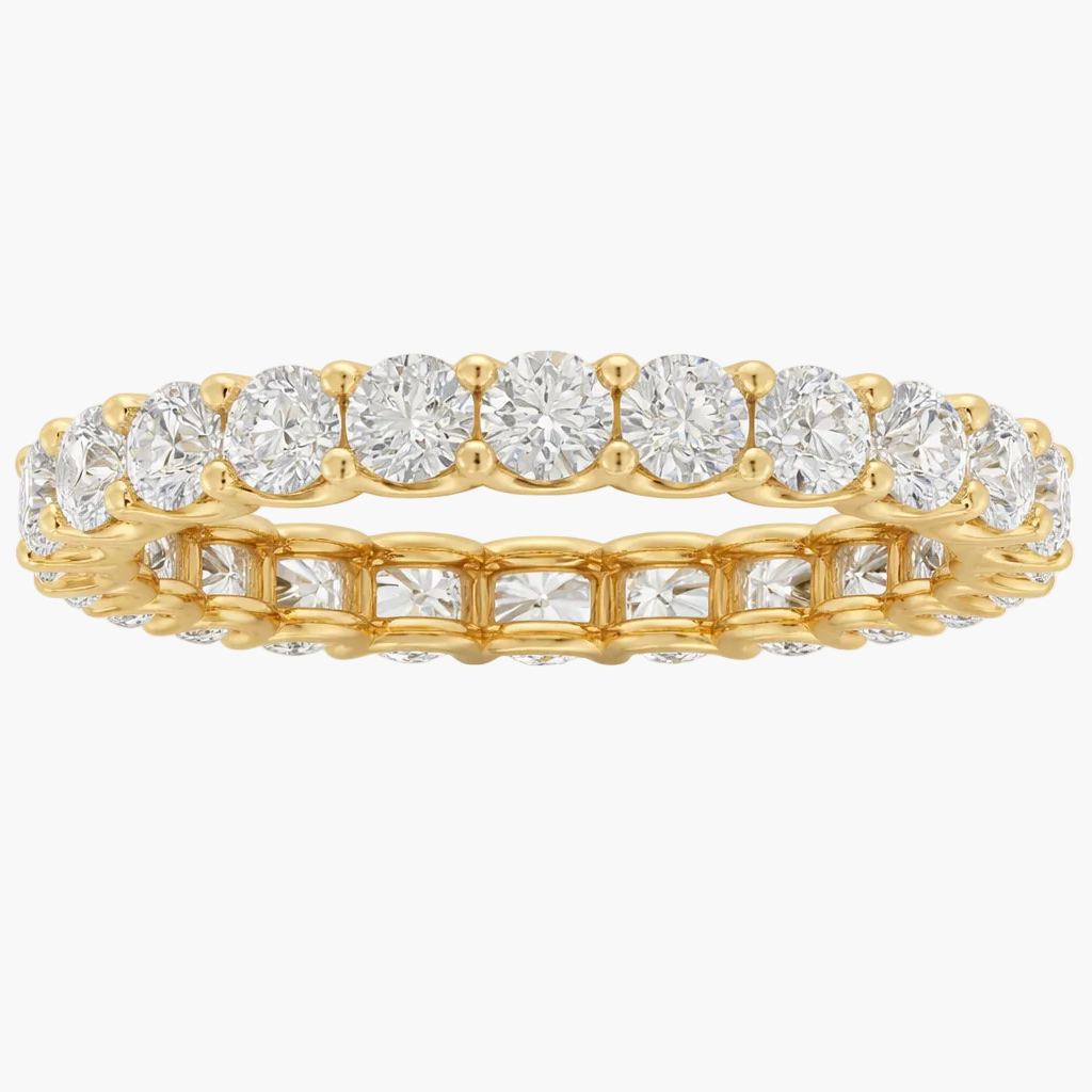Gold ring with diamonds on a white background