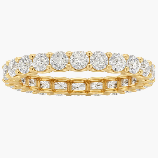 Gold ring with diamonds on a white background