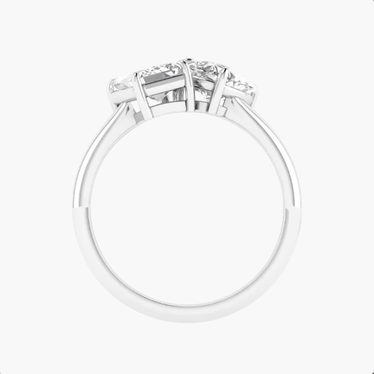 Diamond ring with three stones on a white background
