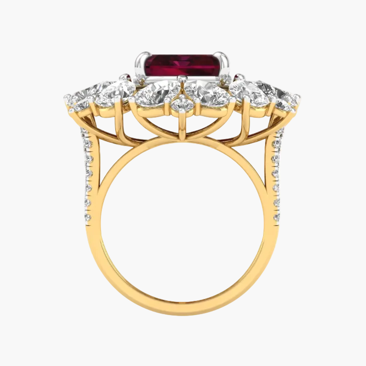 Gold ring with a red gemstone and diamond accents on a white background