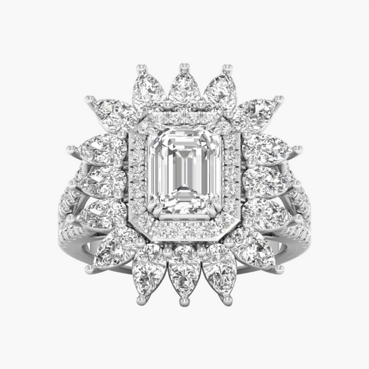 Elegant diamond ring with a central emerald-cut gemstone and floral-style halo on a white background