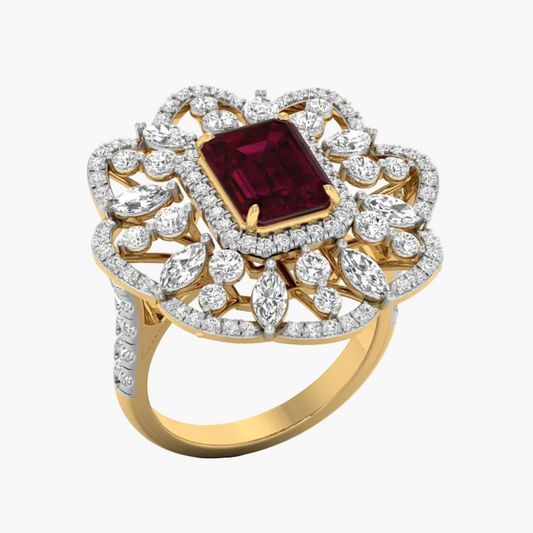 Gold ring with a red gemstone and diamond accents on a white background