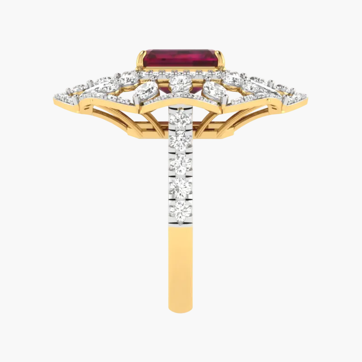 Gold ring with a red gemstone and diamond accents on a white background