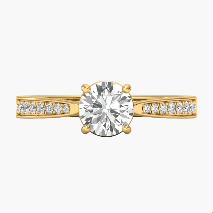 Gold ring with a large diamond and smaller diamonds on the band against a white background